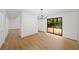Living room with modern light fixture, new floors and view to the outdoor space at 76 Forrest Pl, Atlanta, GA 30328