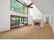 Spacious living room with tall ceilings, fireplace, and access to the screened-in porch at 76 Forrest Pl, Atlanta, GA 30328