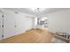 Living room with new floors, modern light fixture and view to kitchen at 76 Forrest Pl, Atlanta, GA 30328