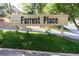 A welcoming neighborhood entrance sign that reads Forrest Place at 76 Forrest Pl, Atlanta, GA 30328