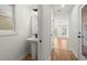 Bathroom featuring hardwood floors, pedestal sink and a view into the living room at 988 Mcdaniel Sw St, Atlanta, GA 30310