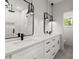 Modern bathroom with double vanity, sleek fixtures, quartz countertop, and stylish pendant lighting at 988 Mcdaniel Sw St, Atlanta, GA 30310