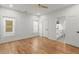 Large bedroom with hardwood floors, ceiling fan and view to bathroom at 988 Mcdaniel Sw St, Atlanta, GA 30310