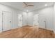 Spacious bedroom with hardwood floors, ceiling fan, and access to the bathroom and closet at 988 Mcdaniel Sw St, Atlanta, GA 30310