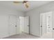 Light-filled bedroom with plush carpeting, a ceiling fan, and access to a bathroom and closet at 988 Mcdaniel Sw St, Atlanta, GA 30310