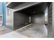 Stylish outdoor patio area featuring a dark siding, gravel, and concrete floors, ideal for relaxation and entertaining at 988 Mcdaniel Sw St, Atlanta, GA 30310