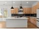 Modern kitchen with stainless steel appliances, black backsplash, and pendant lighting at 988 Mcdaniel Sw St, Atlanta, GA 30310