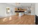 Open-concept kitchen featuring a central island, modern appliances, and light wood cabinetry at 988 Mcdaniel Sw St, Atlanta, GA 30310