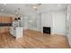 Bright, open-concept living space with hardwood floors, fireplace and a modern kitchen at 988 Mcdaniel Sw St, Atlanta, GA 30310