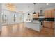 Open-concept living and kitchen area with modern fixtures and hardwood flooring at 988 Mcdaniel Sw St, Atlanta, GA 30310