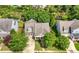 Aerial view of the home showcasing its well-manicured lawn, mature trees, and neighborhood setting at 998 Regal Hills Ln, Mableton, GA 30126