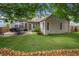 Green backyard with patio area and landscaped design at 998 Regal Hills Ln, Mableton, GA 30126