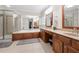 Bathroom with soaking tub, separate shower, dual vanities, and tile floor at 998 Regal Hills Ln, Mableton, GA 30126