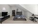 Spacious bedroom showcasing sloped ceilings, neutral walls, and carpeted floors at 998 Regal Hills Ln, Mableton, GA 30126