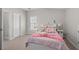 Cozy bedroom with neutral walls, carpet, and plenty of natural light from the window at 998 Regal Hills Ln, Mableton, GA 30126