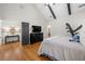 Bedroom with wood floor, high ceilings, ceiling fan, windows and a dresser at 998 Regal Hills Ln, Mableton, GA 30126