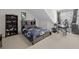 Comfortable bedroom featuring carpet flooring, sloped ceilings, and built-in shelving at 998 Regal Hills Ln, Mableton, GA 30126