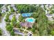 Overhead view showing community pool and tennis courts in a well-landscaped neighborhood at 998 Regal Hills Ln, Mableton, GA 30126