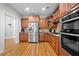 Stylish kitchen featuring stainless steel appliances, granite countertops, and ample wood cabinetry at 998 Regal Hills Ln, Mableton, GA 30126