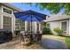 Outdoor patio featuring a dining set, grill, and landscaping at 998 Regal Hills Ln, Mableton, GA 30126