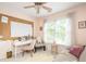 Cozy bedroom area with sofa, work desk, plush rug, and natural light streaming in from the large windows at 207 Wesley Ne Ave, Atlanta, GA 30307