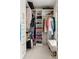 Walk-in closet featuring custom shelving, ample storage, and a cozy bench at 207 Wesley Ne Ave, Atlanta, GA 30307