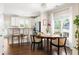 Bright dining area with hardwood floors, modern lighting, and natural light from large windows at 207 Wesley Ne Ave, Atlanta, GA 30307