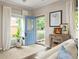 Bright entryway featuring a blue front door, natural light, neutral walls, and hardwood floors at 207 Wesley Ne Ave, Atlanta, GA 30307