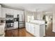 Updated kitchen boasts stainless appliances, granite counters, and a breakfast bar at 207 Wesley Ne Ave, Atlanta, GA 30307