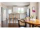 Open kitchen and dining area with white cabinets, stainless steel appliances, and a breakfast bar at 207 Wesley Ne Ave, Atlanta, GA 30307