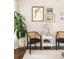Cozy living room with hardwood floors, artfully decorated walls and furniture, and a plant at 207 Wesley Ne Ave, Atlanta, GA 30307