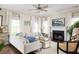 Inviting living room with a fireplace, hardwood floors, comfortable seating, and large windows at 207 Wesley Ne Ave, Atlanta, GA 30307