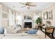 Elegant living room featuring a fireplace, stylish decor, and natural light from large windows at 207 Wesley Ne Ave, Atlanta, GA 30307