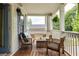 Cozy porch with wood floors, comfortable seating, and peaceful outdoor views at 207 Wesley Ne Ave, Atlanta, GA 30307