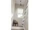 Bright staircase featuring white railing, natural light, and a cozy reading nook at 207 Wesley Ne Ave, Atlanta, GA 30307