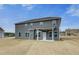 Spacious backyard featuring a two-story home with a covered patio at 242 Linford Dr, Locust Grove, GA 30248