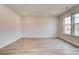 Bright and spacious bedroom with hardwood floors, neutral walls, and ample natural light from large windows at 242 Linford Dr, Locust Grove, GA 30248