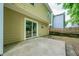 View of the backyard with a concrete patio and sliding glass door entry to the home's interior at 3454 Benthollow Ln, Duluth, GA 30096