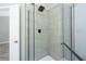 Modern bathroom with glass shower enclosure and sleek fixtures at 3454 Benthollow Ln, Duluth, GA 30096