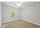 Bedroom with carpet, ceiling fan, and natural light from window at 3454 Benthollow Ln, Duluth, GA 30096
