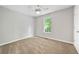 Bedroom featuring carpet, ceiling fan, and natural light from window at 3454 Benthollow Ln, Duluth, GA 30096