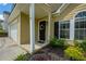 Front door with beautiful wreath, with black shutters and beige siding at 3454 Benthollow Ln, Duluth, GA 30096