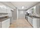 Spacious kitchen with new countertops, stainless steel appliances, and tile floors at 3454 Benthollow Ln, Duluth, GA 30096