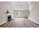 Spacious living room with high ceilings, fireplace, and many windows for natural light at 3454 Benthollow Ln, Duluth, GA 30096