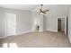 Carpeted main bedroom with natural light and multiple entryways at 3454 Benthollow Ln, Duluth, GA 30096