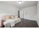 Bedroom with dark hardwood floor and pullout sofa at 3949 Glenview Club Ln, Duluth, GA 30097