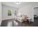 Cozy bedroom featuring a daybed, hardwood floors, and sun-filled windows at 3949 Glenview Club Ln, Duluth, GA 30097