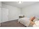 Bedroom with a bed, desk, carpet floor, natural light and neutral paint at 3949 Glenview Club Ln, Duluth, GA 30097