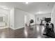 Spacious bonus room featuring hardwood floors, a TV, and an exercise area at 3949 Glenview Club Ln, Duluth, GA 30097