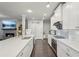 Bright kitchen featuring a center island, stainless steel appliances, and white cabinets at 3949 Glenview Club Ln, Duluth, GA 30097